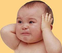 A baby crying and in distress.