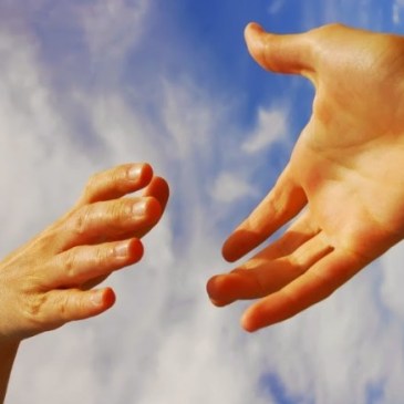 two hands reaching out to each other in kindness