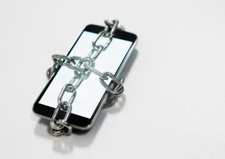 smart phone wrapped in chain