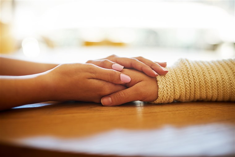 friends comforting each other, showing kindness