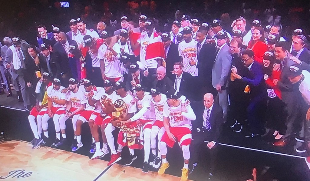Toronto Raptors pose for a group shot after celebrating their win.