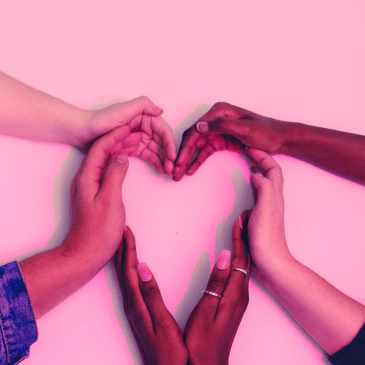 hands of different ethnicities connecting together to form a heart