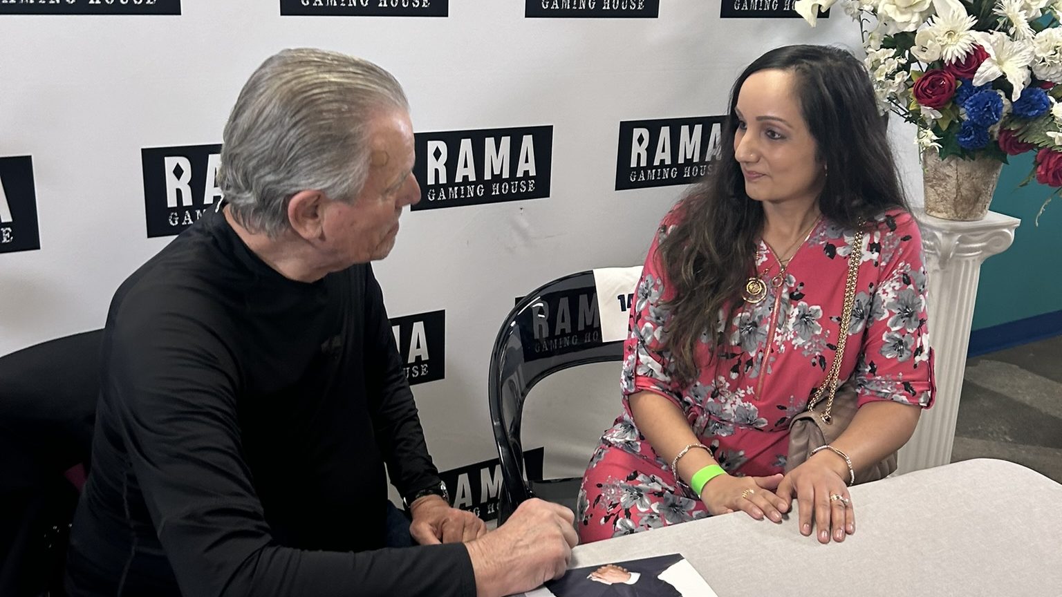 Two people conversing with each other.